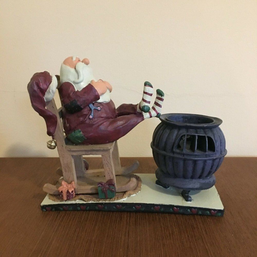 Small Relaxing Santa Figure by Rocking Chair and C